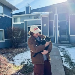 a man holding a cat