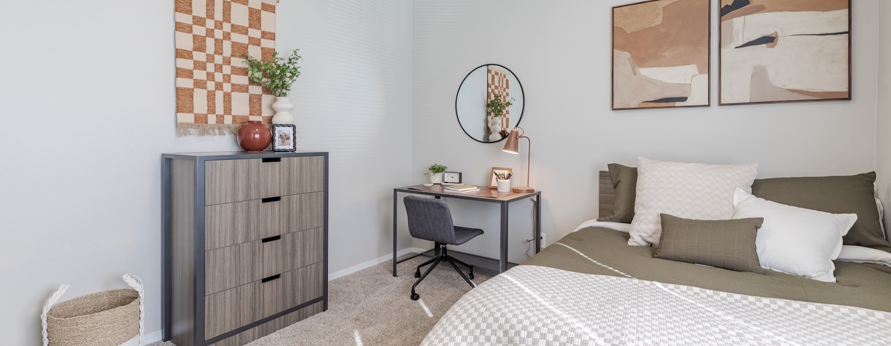 a bedroom with a bed and a desk