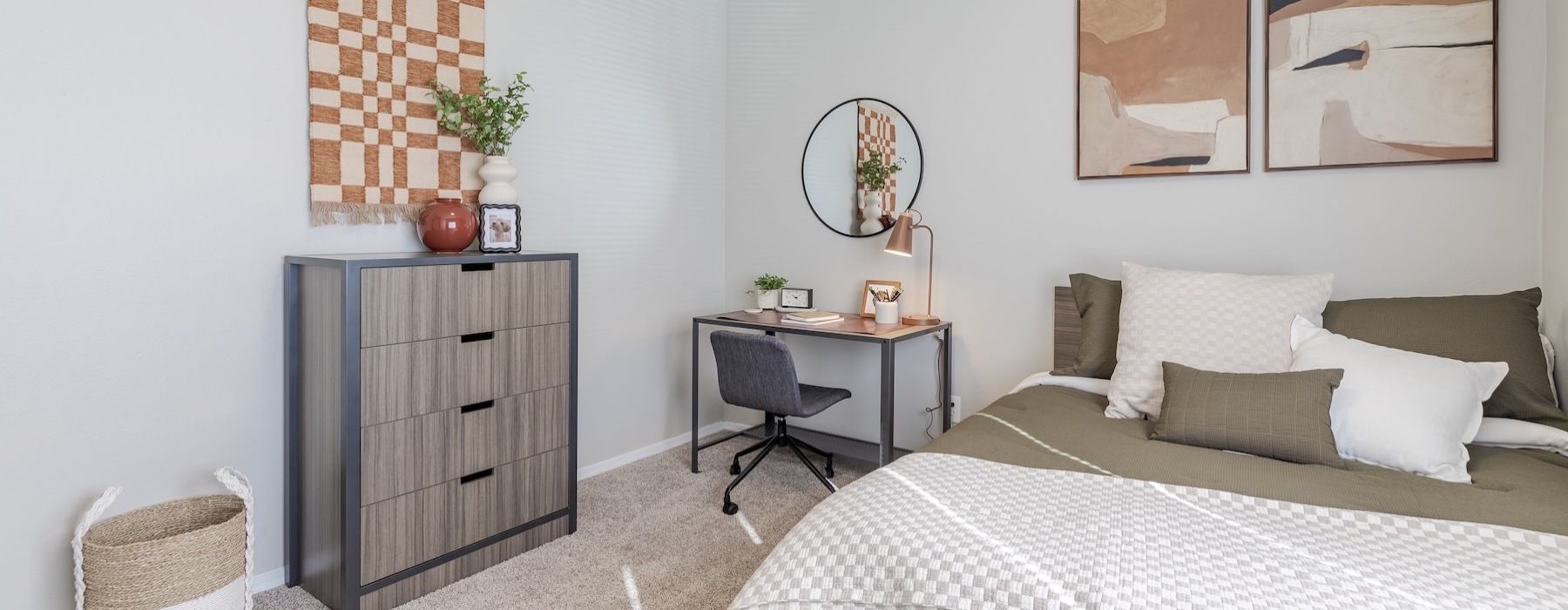 a bedroom with a bed and a desk