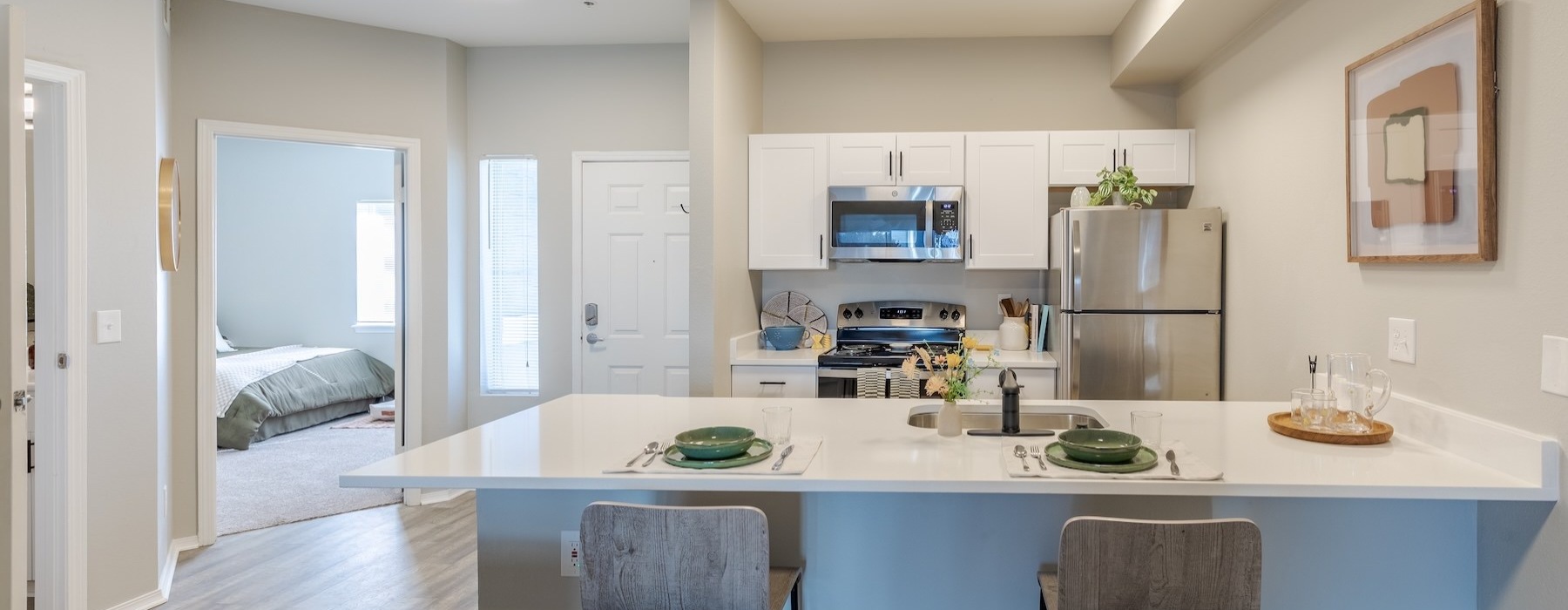 a kitchen with a table and chairs